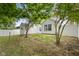 Backyard view with lush grass, mature trees, shed, and privacy fence at 2289 Salem Park Dr, Indianapolis, IN 46239