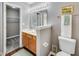 Bathroom with oak vanity, a well-lit mirror, and a linen closet for practical storage, adding convenience and functionality at 2289 Salem Park Dr, Indianapolis, IN 46239