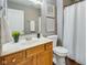 Bathroom with wood vanity, marble countertop, and framed wall art at 2289 Salem Park Dr, Indianapolis, IN 46239