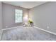 Bright bedroom featuring gray walls, plush carpeting, a window, and decorative accents at 2289 Salem Park Dr, Indianapolis, IN 46239
