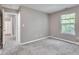 Bedroom with soft carpet, neutral walls, and natural light from window at 2289 Salem Park Dr, Indianapolis, IN 46239