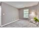 Bedroom with a large window providing natural light and soft gray carpeting at 2289 Salem Park Dr, Indianapolis, IN 46239