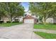 Attractive two-story home with a well-manicured lawn, mature trees and a spacious two-car garage at 2289 Salem Park Dr, Indianapolis, IN 46239