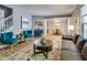 Well-decorated living room offers cozy seating, stylish decor, and a view to the dining room at 2289 Salem Park Dr, Indianapolis, IN 46239