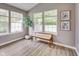 Sun room featuring large windows, bench, and potted plant, perfect for enjoying natural light and garden views at 2289 Salem Park Dr, Indianapolis, IN 46239