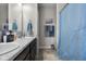 Bathroom features a double sink with granite counters and wood cabinets at 2421 Creek Bank Dr, Columbus, IN 47201