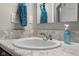 Bathroom sink with a white countertop, stylish faucet and ample counter space at 2421 Creek Bank Dr, Columbus, IN 47201