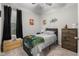 Cozy bedroom with a ceiling fan, a window letting in natural light and carpet flooring at 2421 Creek Bank Dr, Columbus, IN 47201