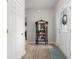 Welcoming entryway featuring hardwood floors, a decorative cabinet, and natural light at 2421 Creek Bank Dr, Columbus, IN 47201