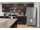 Well-equipped kitchen features stainless steel appliances and stylish backsplash at 2421 Creek Bank Dr, Columbus, IN 47201
