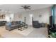 Comfortable living room with a plush sofa, accent chair, and a ceiling fan at 2421 Creek Bank Dr, Columbus, IN 47201