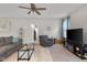 Comfortable living room features neutral colors, comfortable seating and natural light at 2421 Creek Bank Dr, Columbus, IN 47201