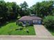 Aerial view of the charming gray home with a spacious front yard and inviting front deck at 2610 Caroline Ave, Indianapolis, IN 46218