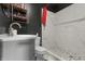 Bathroom featuring shower with white tile, toilet, and marble vanity at 2610 Caroline Ave, Indianapolis, IN 46218