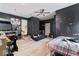 A spacious bedroom is captured with a ceiling fan and hardwood floors at 2610 Caroline Ave, Indianapolis, IN 46218