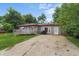 Charming one-story home with a long drive and a cozy front deck at 2610 Caroline Ave, Indianapolis, IN 46218
