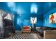 Bright blue living room with neutral furniture and a large patterned rug at 2610 Caroline Ave, Indianapolis, IN 46218