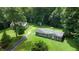Aerial view of a home with a detached garage, surrounded by trees and a well-maintained lawn at 290 S Buffalo Hill Rd, Martinsville, IN 46151