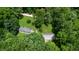 Overhead view of a house with a vast yard and mature trees, with driveway and additional storage shed at 290 S Buffalo Hill Rd, Martinsville, IN 46151