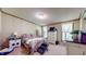 Comfortable bedroom featuring a cozy bed, matching nightstands, and a large window at 290 S Buffalo Hill Rd, Martinsville, IN 46151