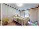 Cozy bedroom featuring a comfortable bed with patterned bedding and a window with natural light at 290 S Buffalo Hill Rd, Martinsville, IN 46151