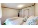 A lovely bedroom featuring neutral-toned walls, comfortable bedding, and a view into another room at 290 S Buffalo Hill Rd, Martinsville, IN 46151
