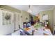 Welcoming dining area featuring a wooden table and chair set, with view into kitchen at 290 S Buffalo Hill Rd, Martinsville, IN 46151