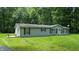 Charming single-story home with a well-maintained lawn, inviting entryway, and mature trees at 290 S Buffalo Hill Rd, Martinsville, IN 46151