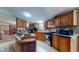 Functional kitchen with wooden cabinets, essential appliances, and ample countertop space at 290 S Buffalo Hill Rd, Martinsville, IN 46151