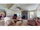 Inviting living room with stone fireplace, comfortable seating, and views of the kitchen at 290 S Buffalo Hill Rd, Martinsville, IN 46151