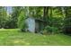 Rustic shed with peeling paint, surrounded by lush greenery and a variety of foliage at 290 S Buffalo Hill Rd, Martinsville, IN 46151