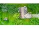 A well maintained home showing the roof, surrounding trees, the lawn, and a storage shed at 3025 Sable Ridge Ln, Greenwood, IN 46142