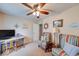 A well-lit bedroom with desk, chairs, and neutral color palette at 3025 Sable Ridge Ln, Greenwood, IN 46142