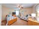 A shared bedroom with twin beds and soft, neutral walls at 3025 Sable Ridge Ln, Greenwood, IN 46142
