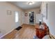 Entryway with wood-look floors, traditional door, and view of an adjacent utility space at 3025 Sable Ridge Ln, Greenwood, IN 46142