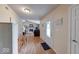 Entryway with wood-look floors, traditional door, and view of a fireplace and living space at 3025 Sable Ridge Ln, Greenwood, IN 46142