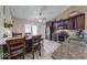 Eat-in kitchen featuring dark cabinetry, granite countertops, stainless steel appliances, and tile floors at 3025 Sable Ridge Ln, Greenwood, IN 46142