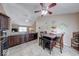 Charming eat-in kitchen features dark wood cabinets, granite counters, and tile floors at 3025 Sable Ridge Ln, Greenwood, IN 46142