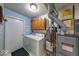 Functional laundry room with a washer, dryer, and storage at 3025 Sable Ridge Ln, Greenwood, IN 46142