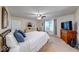Large primary bedroom features natural light, carpet floors, and a ceiling fan at 3025 Sable Ridge Ln, Greenwood, IN 46142