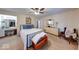 Inviting primary bedroom boasts a ceiling fan, carpet floors, and ensuite bathroom at 3025 Sable Ridge Ln, Greenwood, IN 46142