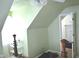 Unique attic bedroom featuring green walls and interesting architectural angles at 3115 E 400 S, Anderson, IN 46017