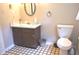 Traditional bathroom with tile flooring, dark wood vanity and framed mirror at 3115 E 400 S, Anderson, IN 46017