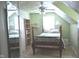 Charming bedroom featuring a queen-sized bed, ample natural light, and shelving for storage at 3115 E 400 S, Anderson, IN 46017