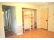 Bedroom with a built-in closet and shelving system, hardwood floors, and neutral tones at 3115 E 400 S, Anderson, IN 46017