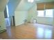 Spacious bedroom with wood floors, sloped ceilings, and windows at 3115 E 400 S, Anderson, IN 46017