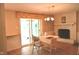 Traditional dining room with a brick fireplace, sliding glass doors, and tile flooring at 3115 E 400 S, Anderson, IN 46017