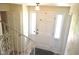 Bright foyer with a white front door, sidelights, and staircase with ornate railings at 3115 E 400 S, Anderson, IN 46017