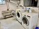 Basement laundry area with washer, dryer, and utility sink at 313 S Brittain Ave, Muncie, IN 47303