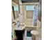 Charming bathroom features white tile, a combination tub and shower with a blue shower curtain at 313 S Brittain Ave, Muncie, IN 47303
